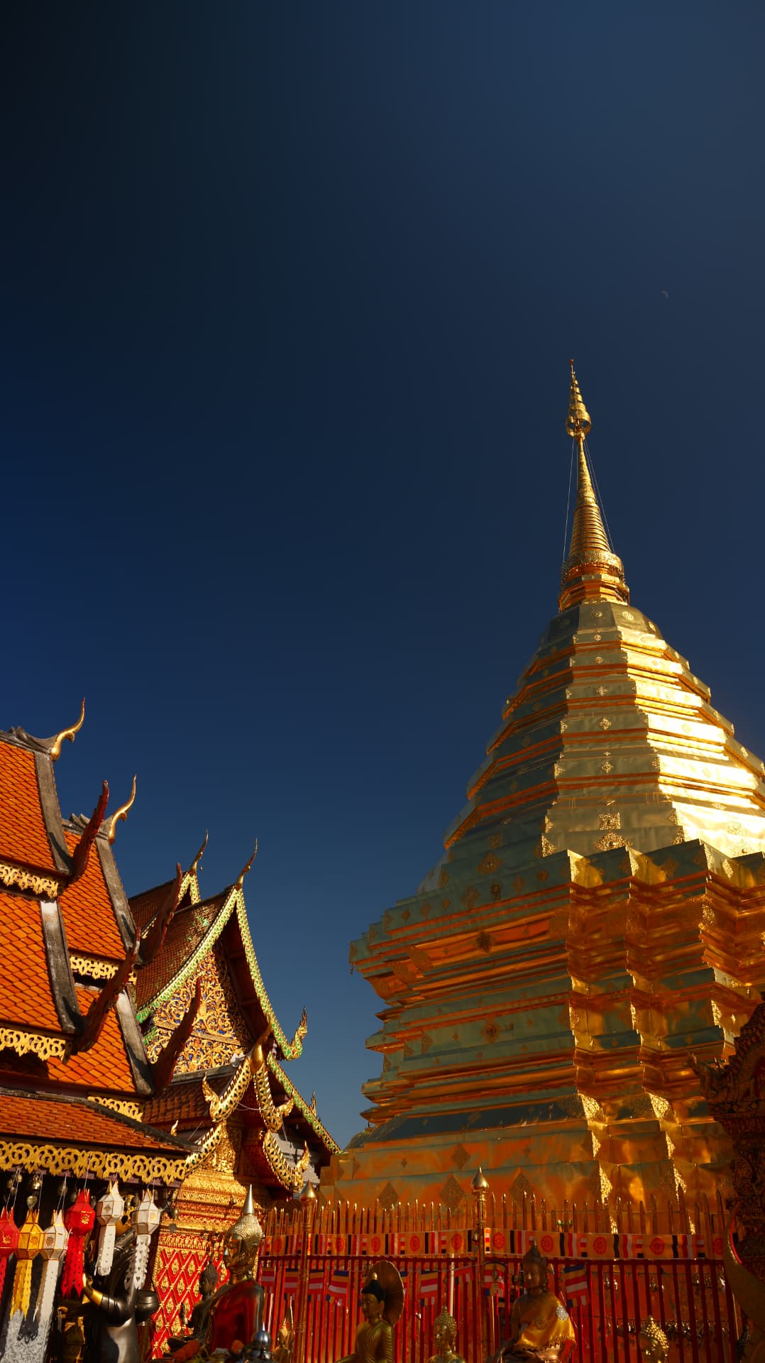 Golden stupa of Doi Suthep glowing at dusk in Chiang Mai