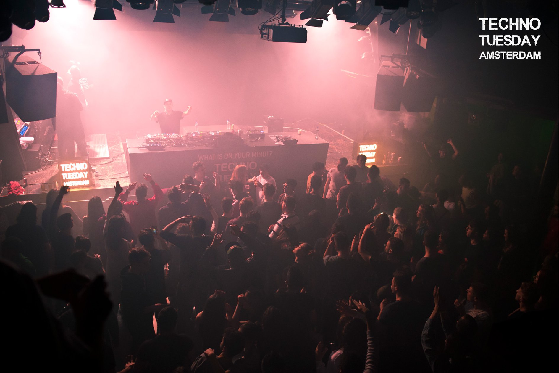Techno Tuesday Amsterdam — DJ booth above a packed dancefloor