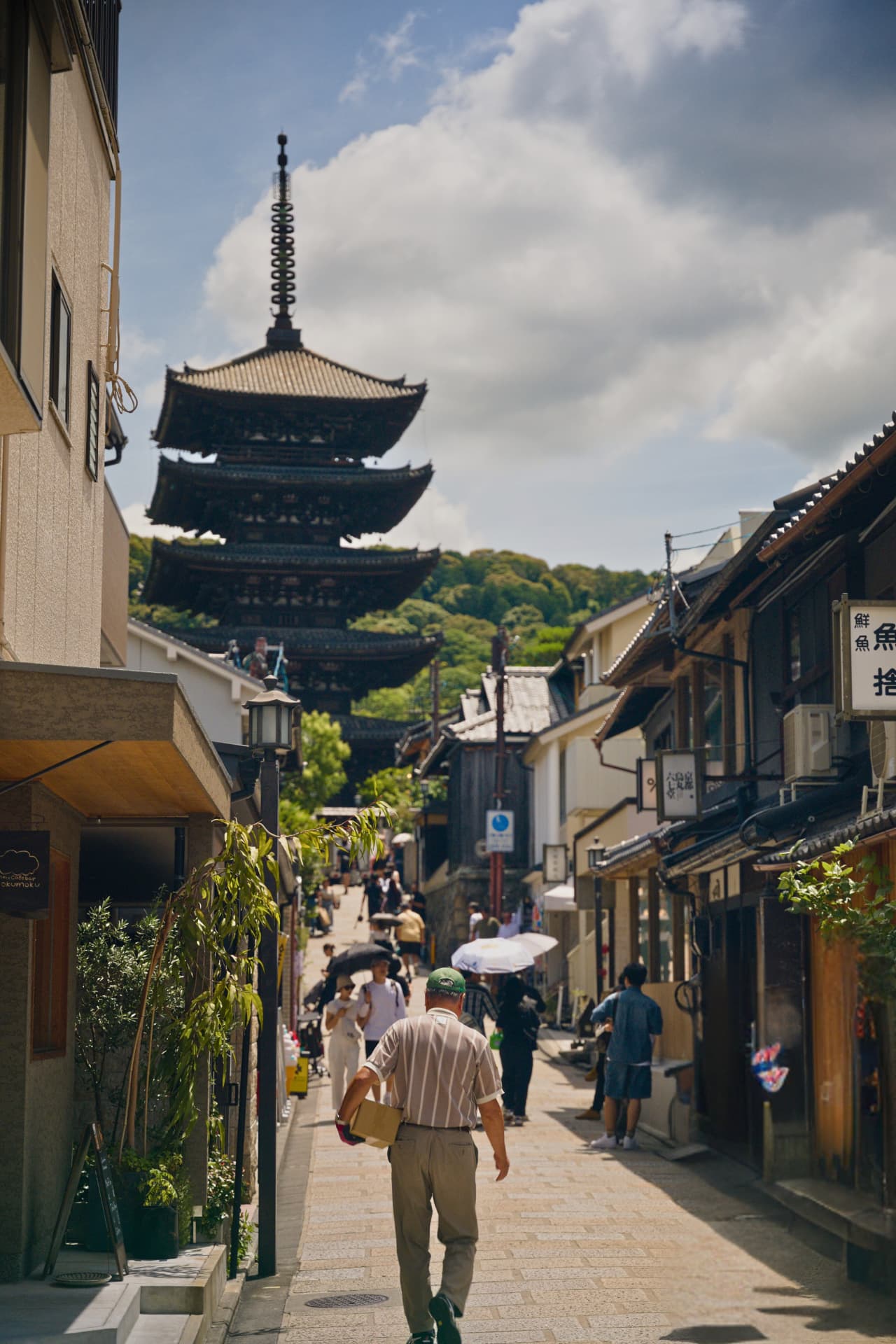 Yasaka pagoda rising above a busy lane in Kyoto