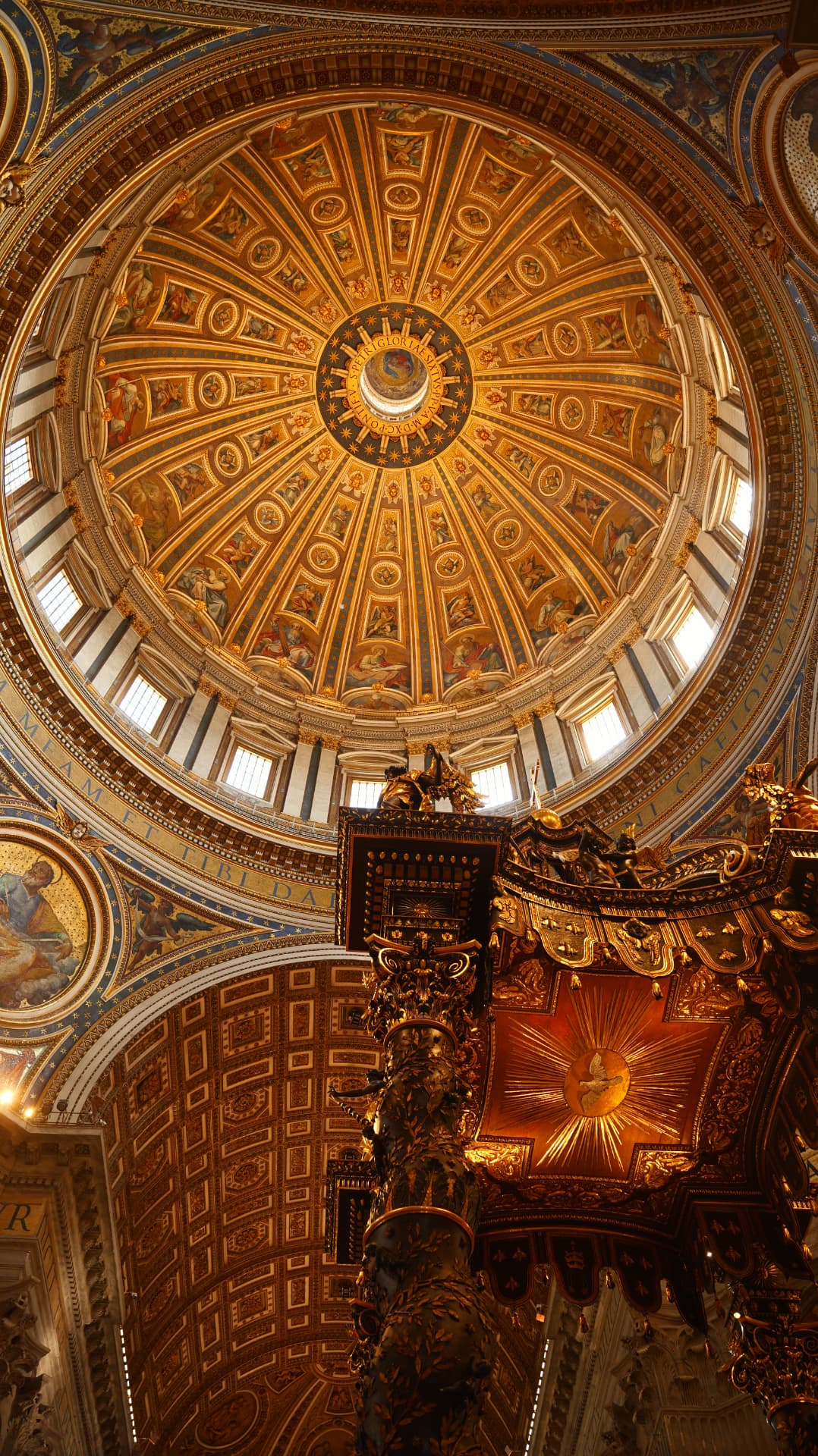 Golden dome of Saint Peter's Basilica above Bernini's baldachin